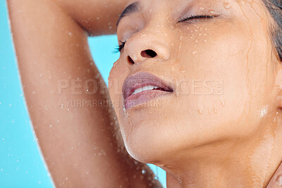 Buy stock photo Relax shower, face and black woman cleaning with water liquid for hydration, beauty healthcare or skincare hygiene. Self care studio, spa salon and wellness model washing isolated on blue background