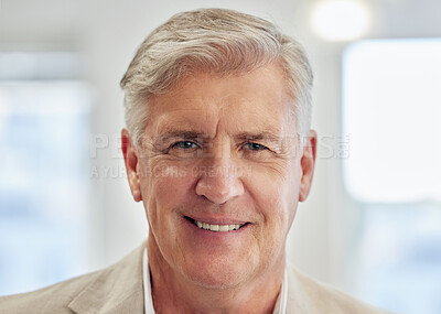 Buy stock photo Shot of a mature businessman standing alone in the office