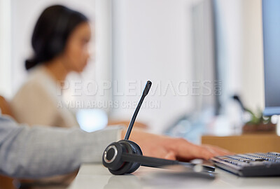 Buy stock photo Shot of a headset on a desk during a day at the call center