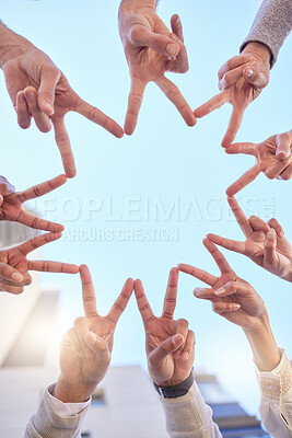 Buy stock photo Low angle shot of a group of businesspeople making a star shape with their fingers