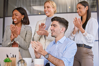 Buy stock photo Shot of a group of businesspeople applauding together in an office