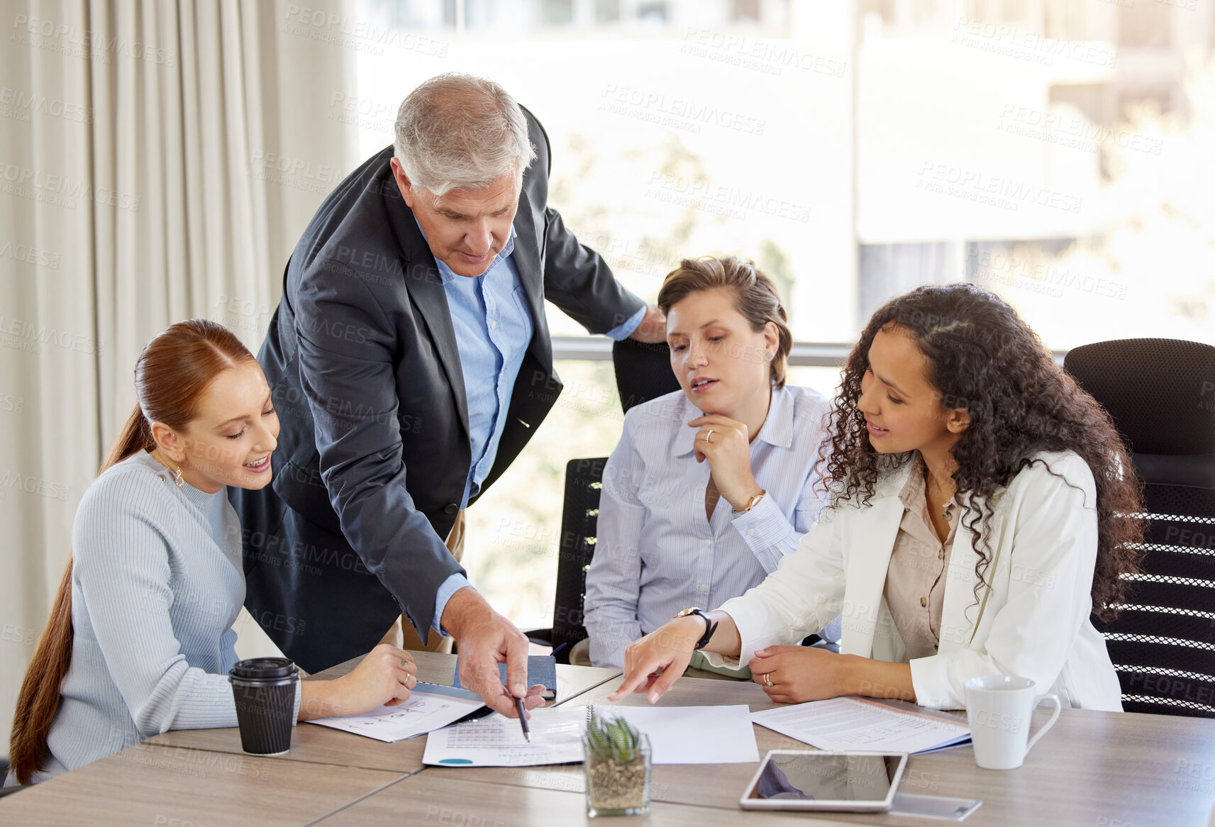 Buy stock photo Shot of a diverse group of businesspeople having a discussion in the office
