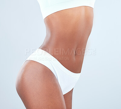 Buy stock photo Cropped shot of a fit young woman posing in her underwear