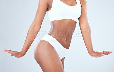 Buy stock photo Cropped shot of a fit young woman posing in her underwear