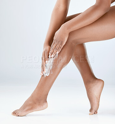 Buy stock photo Cream, legs and hands of woman in studio for natural cosmetics, moisturizer or grooming on white background. Beauty, pamper and female model for organic treatment, wellness or skincare with mockup