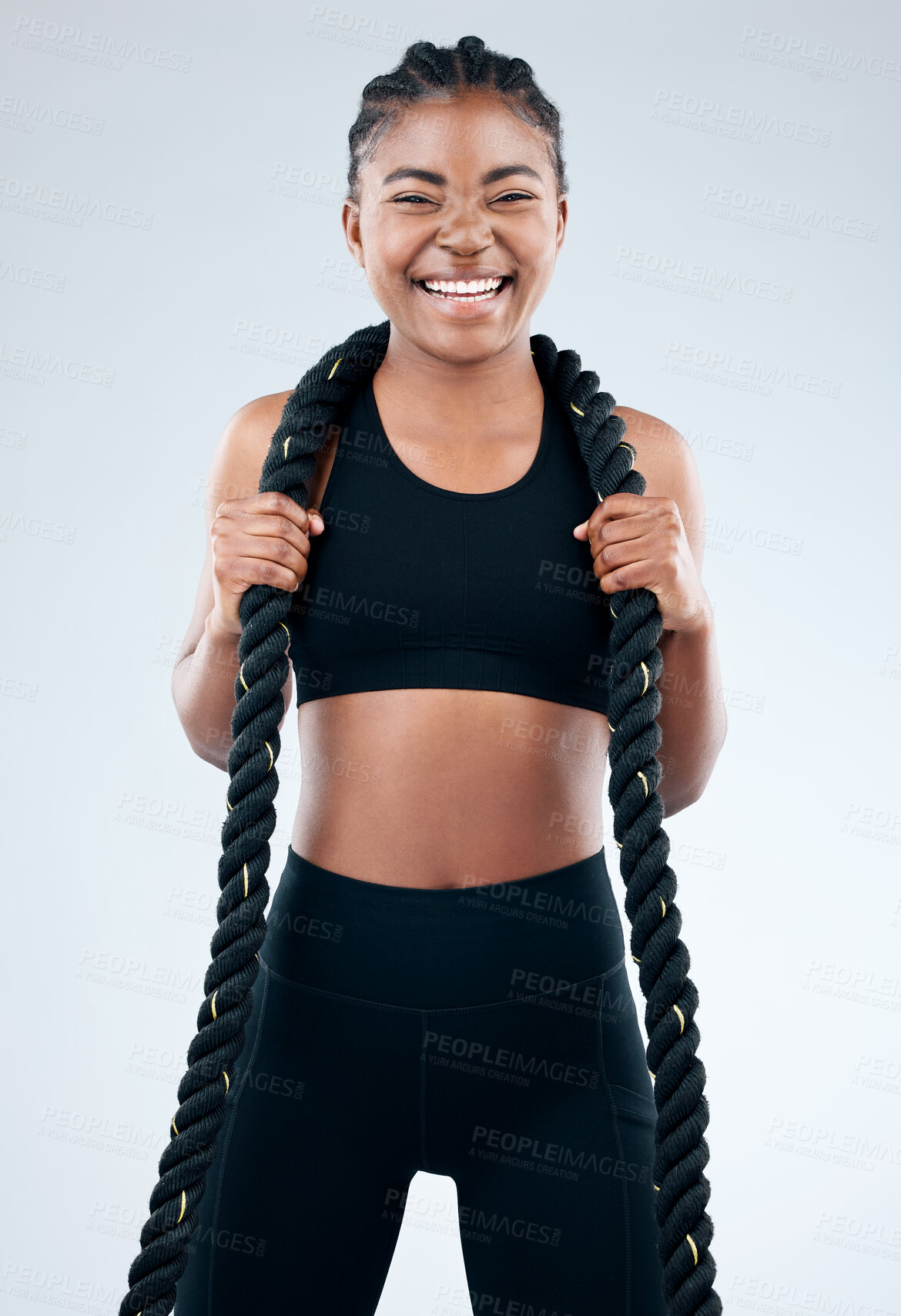 Buy stock photo Portrait, black woman and battle rope for health, fitness and exercise in white background with happiness. Female person, African and excited for workout, training or cardio as athlete in studio