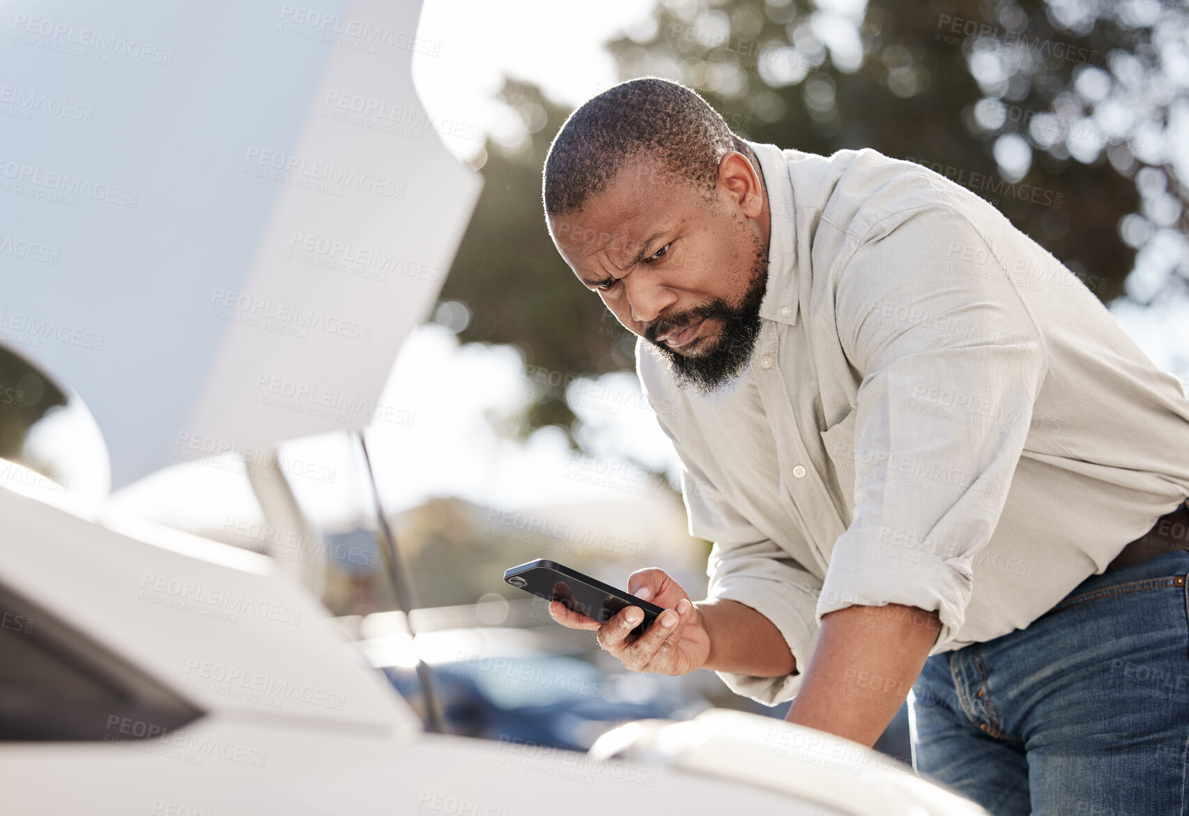 Buy stock photo Breakdown, cellphone and black man by car outdoor to contact roadside assistance for emergency. Insurance, communication and African male person stuck with phone on travel to report faulty engine.