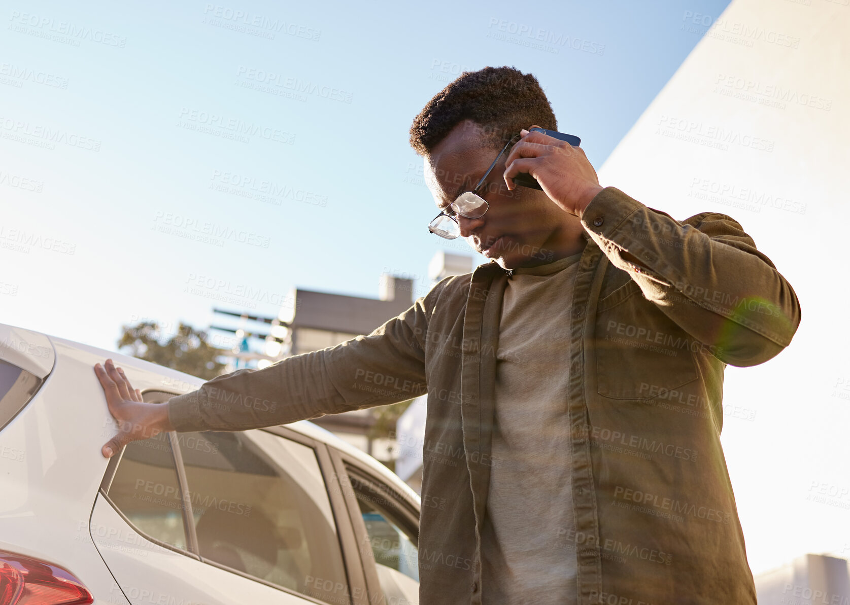 Buy stock photo Shot of a young male stuck with his car outside