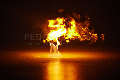 Buy stock photo Studio shot of a small flame burning against a black background