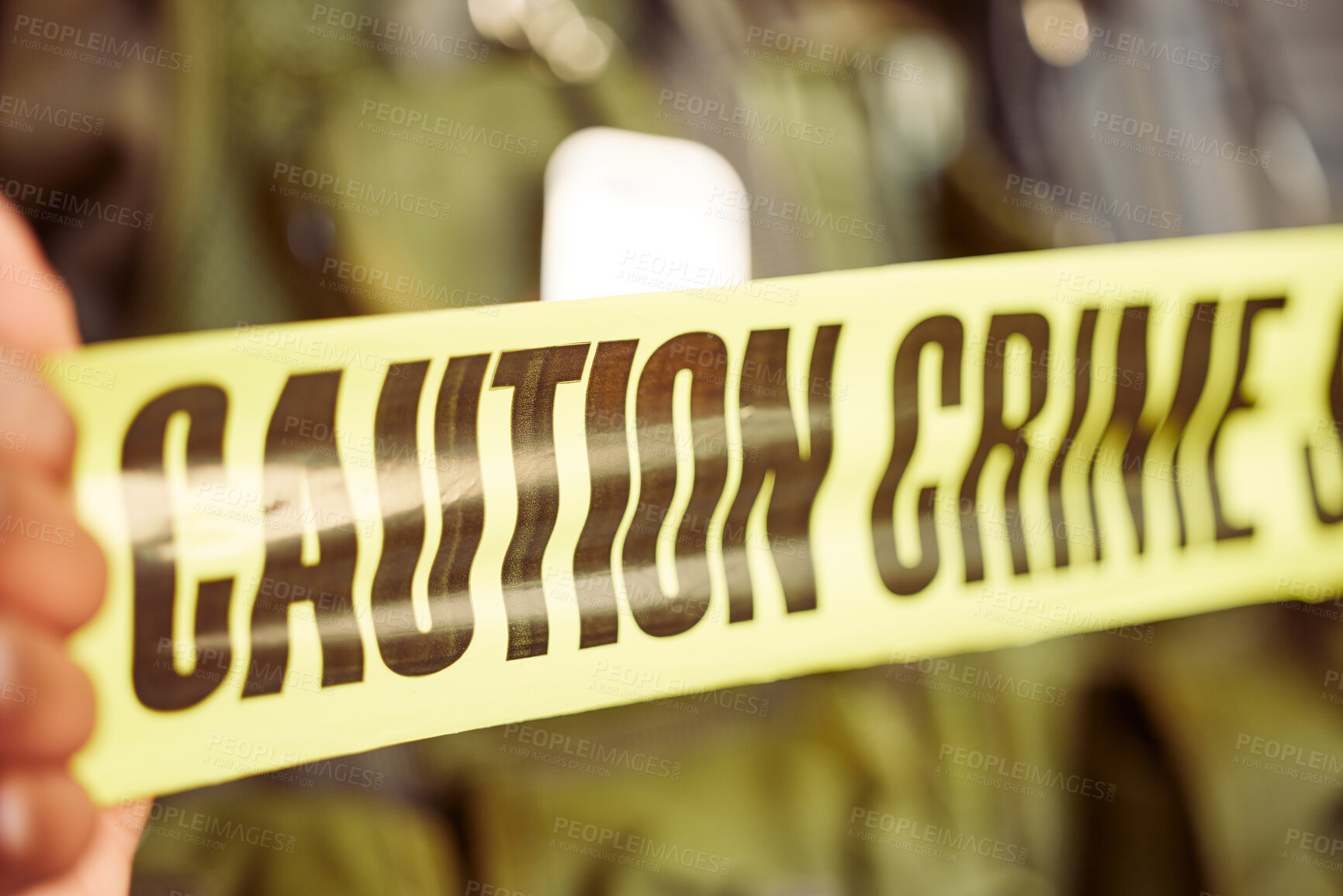 Buy stock photo Shot of caution tape surrounding a crime scene