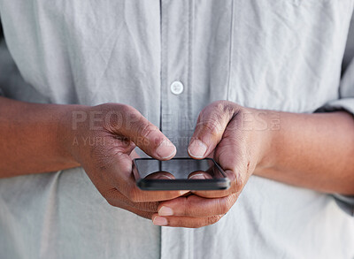 Buy stock photo Shot of an unrecognisable man using a smartphone