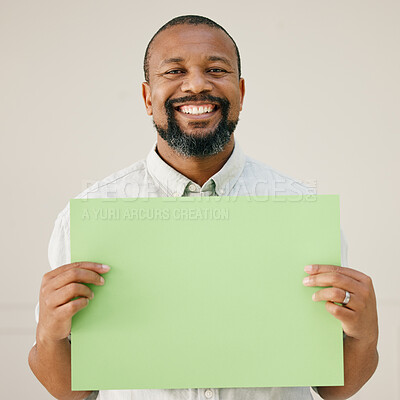 Buy stock photo Portrait, business and black man with green poster for climate change, smile and eco friendly. African person, employee and creative with blank paper, mockup space and promotion on studio background