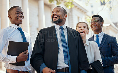 Buy stock photo Shot of a group of lawyers standing in the city