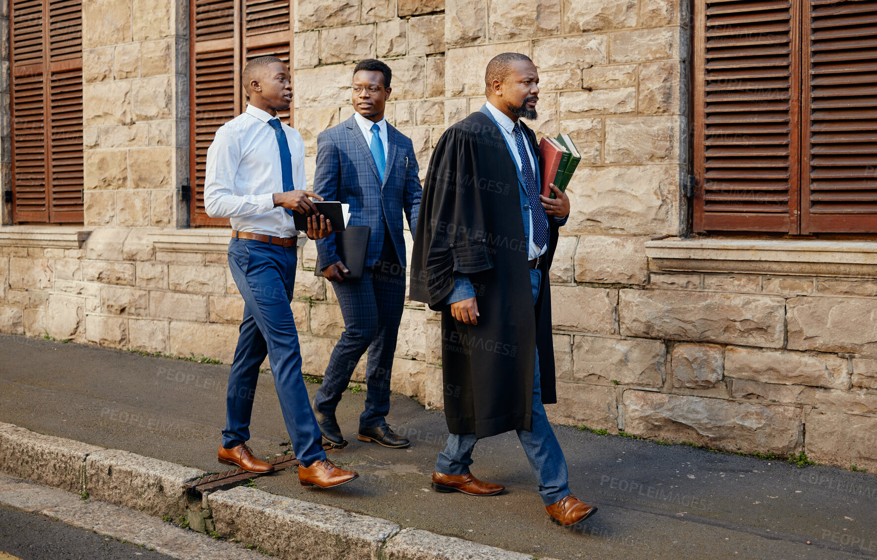 Buy stock photo Shot of a group of lawyers in the city