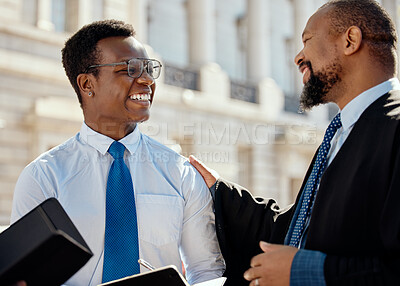 Buy stock photo Shot of two lawyers talking in the city
