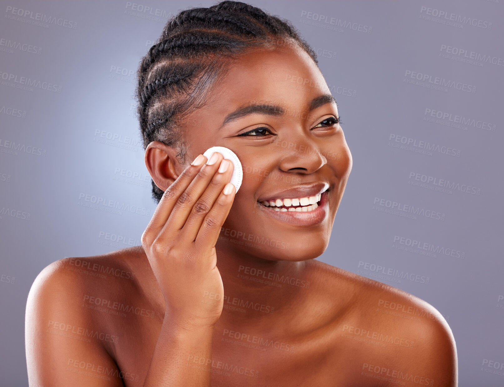 Buy stock photo Black woman, cosmetics and beauty with cotton pad, product and happy for results with cleanser. African, female person and smile for skincare, pride and glow for dermatology in gray background
