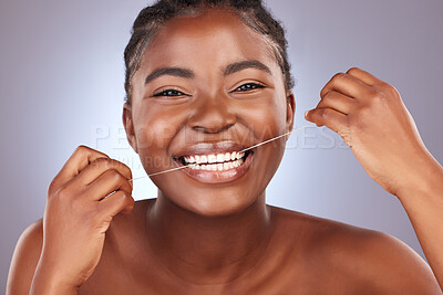 Buy stock photo Floss, happy and portrait of woman in studio with oral health, morning and wellness routine for self care. Smile, hygiene and person clean teeth for plaque removal dental treatment by gray background