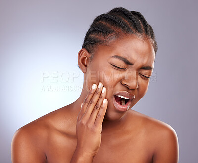 Buy stock photo Toothache, black woman and dental pain in studio with cavity, gum disease and bacteria from gingivitis infection. Healthcare, medical and mouth injury, accident and teeth problem on purple background