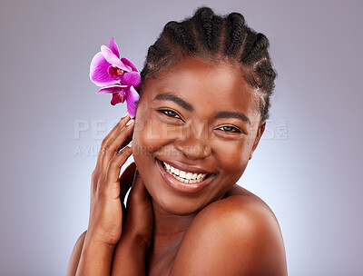 Buy stock photo Skincare, orchid and portrait of black woman in studio with natural, health and facial routine. Beauty, wellness and African model with flower plant for dermatology face treatment by gray background.