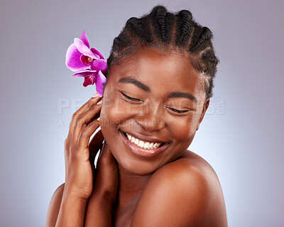 Buy stock photo Skincare, flower and black woman in studio with natural, health and facial routine. Beauty, wellness and African model with orchid plant for dermatology face treatment with glow by gray background.