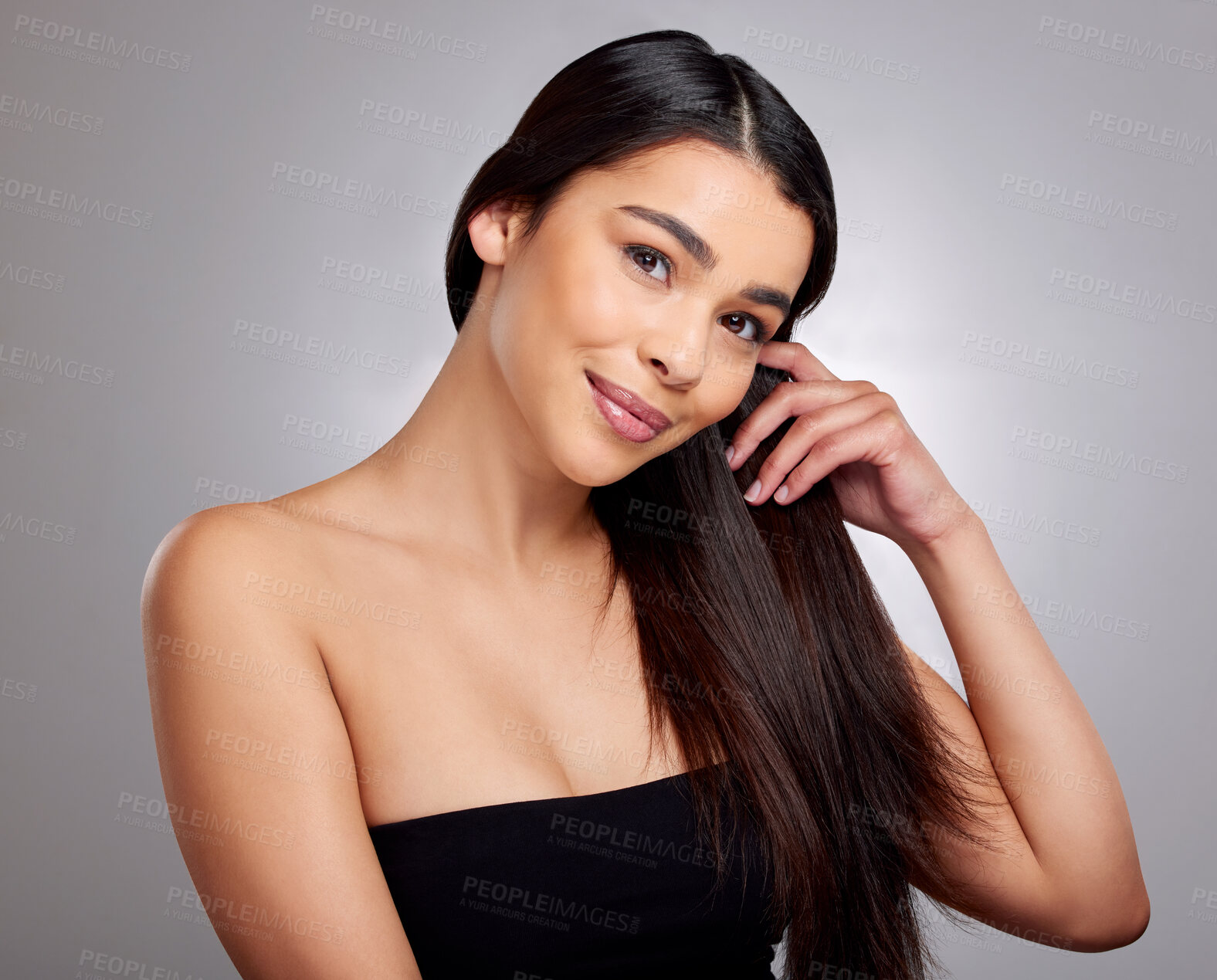 Buy stock photo Happy, woman and portrait in studio for hair care or routine, hairstyle and scalp treatment. Girl, isolated and grey background with healthy growth, natural cosmetic and keratin glow with beauty.