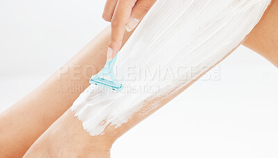 Buy stock photo Woman, legs and shave with cream in studio, hair removal and razor or bladed tool for skincare on white background. Wellness, cosmetic product and body care or grooming, feminine routine and smooth