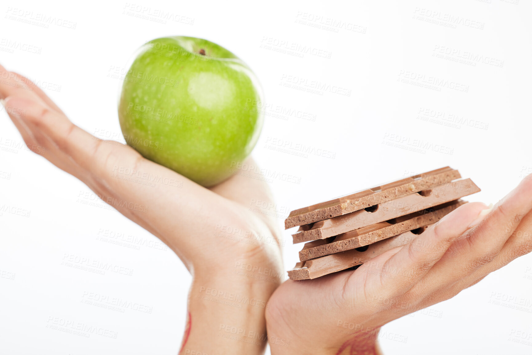 Buy stock photo Decision, hands and apple or chocolate in studio with choice for healthy snack, nutrition benefits and balance diet. Person, food and fruit for breakfast, challenge and wellness on white background