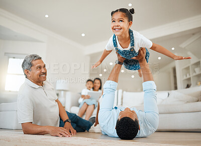Buy stock photo Portrait of a young father and daughter bonding while playing on the floor at home