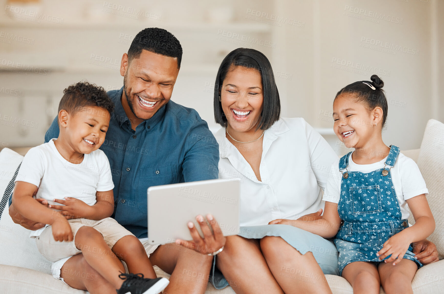 Buy stock photo Happy family, relax and laughing with tablet on sofa for entertainment, comedy or humor at home. Mother, father and children or siblings with smile and enjoying cartoon, movie or shows on technology