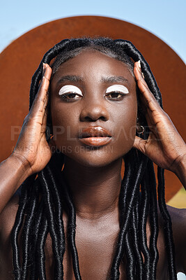 Buy stock photo Cropped portrait of an attractive young woman posing outside