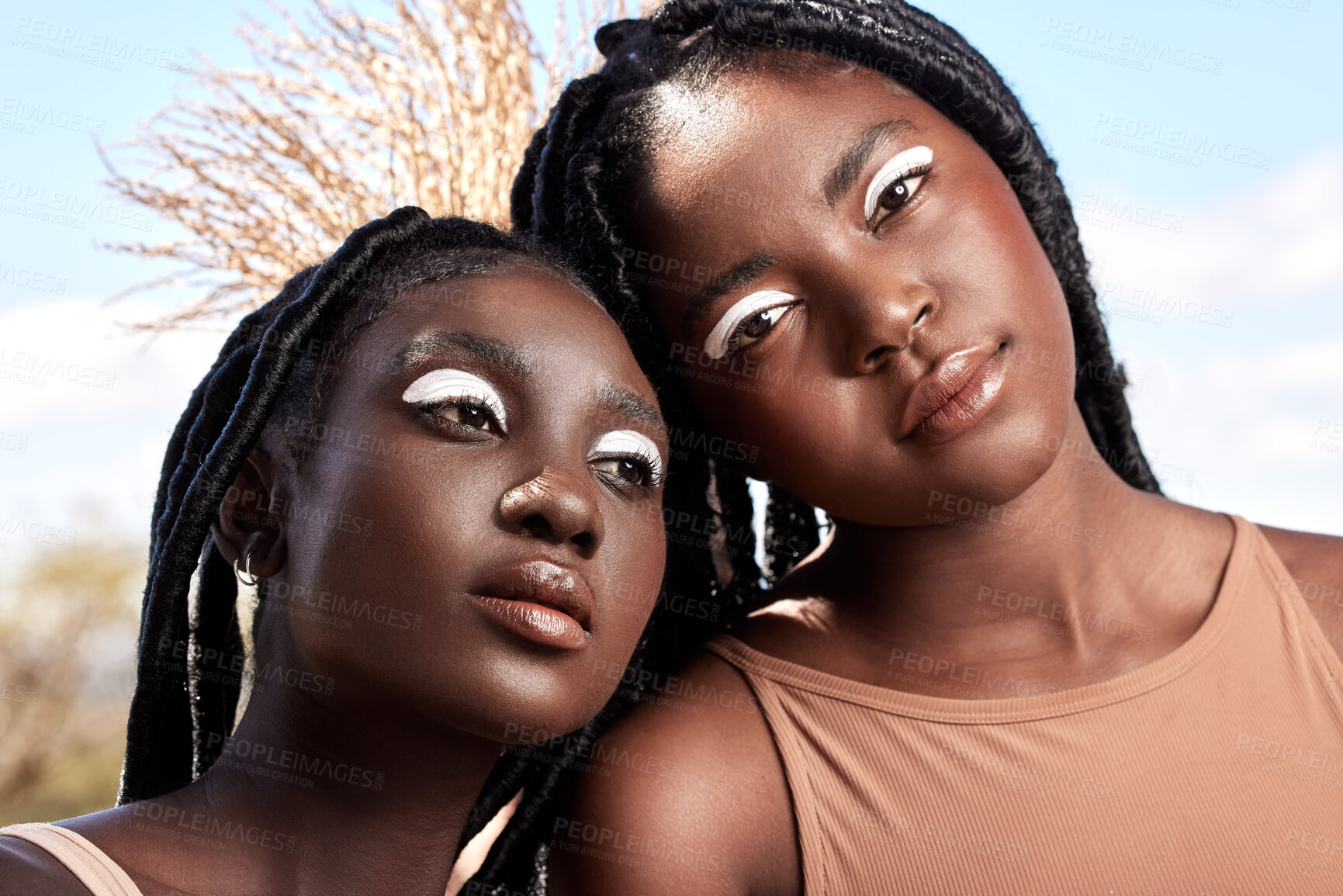 Buy stock photo Cropped shot of two attractive young women posing outside