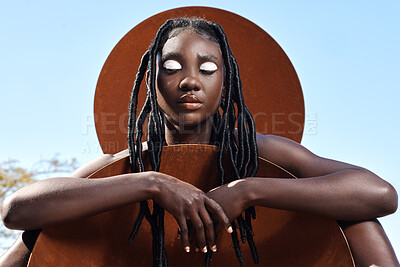 Buy stock photo Cropped shot of an attractive young woman posing outside