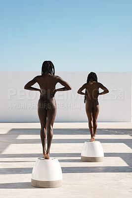 Buy stock photo Rearview shot of two unrecognizable young women posing nude outdoors