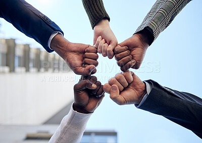 Buy stock photo Group, hands and fist pump together for celebration, collaboration or people in business, company and teamwork. Businesspeople, below and celebrate success, deal or outdoor workplace team building 