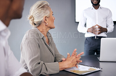 Buy stock photo Senior woman, listening and coaching in meeting presentation for business strategy at the office. Mature female person or CEO with businessman or coach training staff in boardroom at the workplace