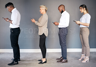 Buy stock photo Business people, phone and networking in waiting room or line for interview, hiring or communication. Group of employees standing in row on smartphone for job search, opportunity or social media