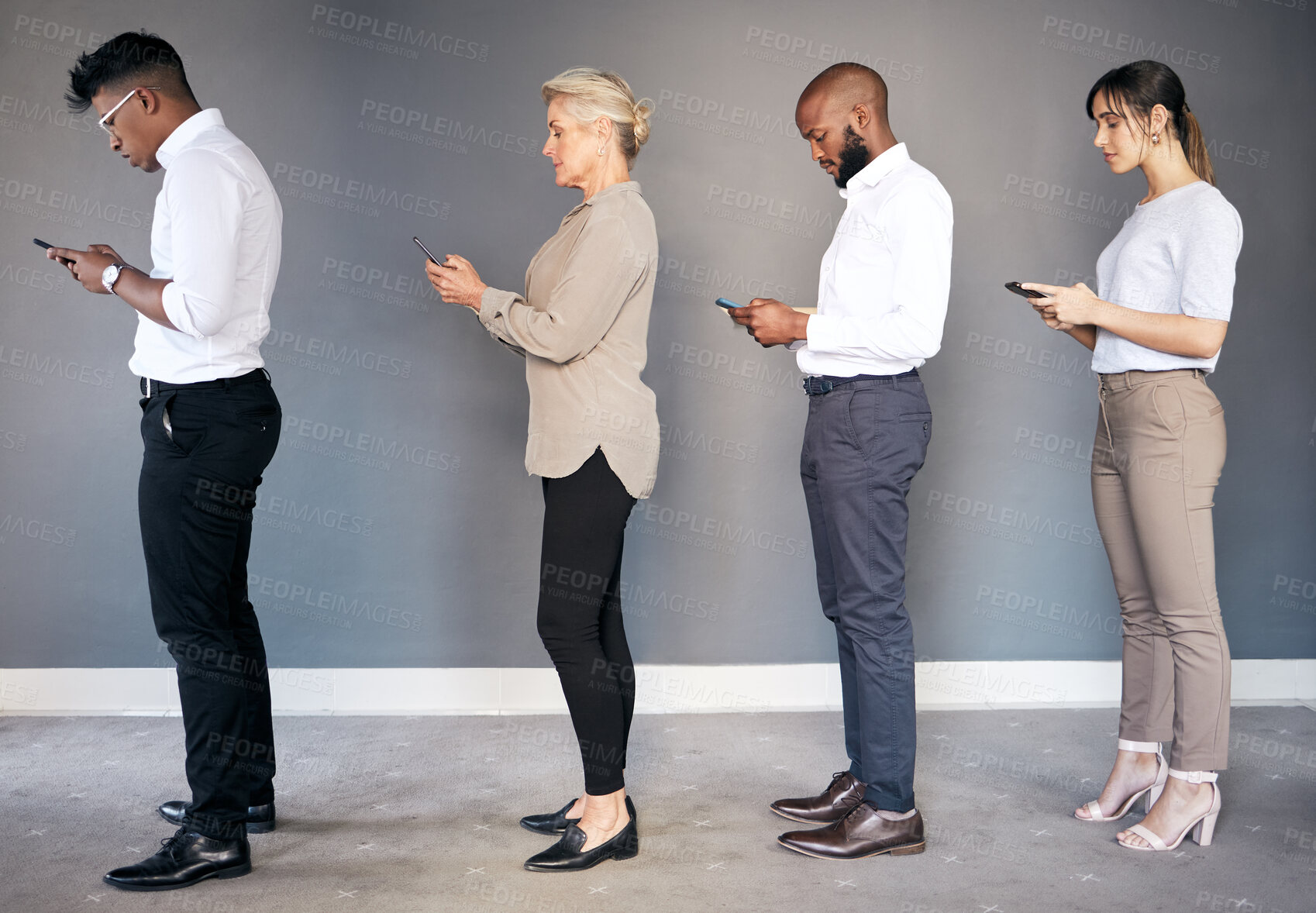 Buy stock photo Business people, phone and networking in waiting room or line for interview, hiring or communication. Group of employees standing in row on smartphone for job search, opportunity or social media