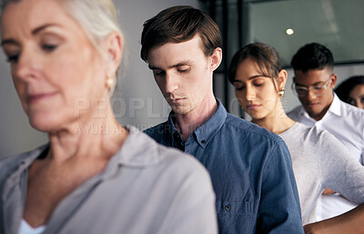 Buy stock photo Shot of a group of businesspeople waiting in line