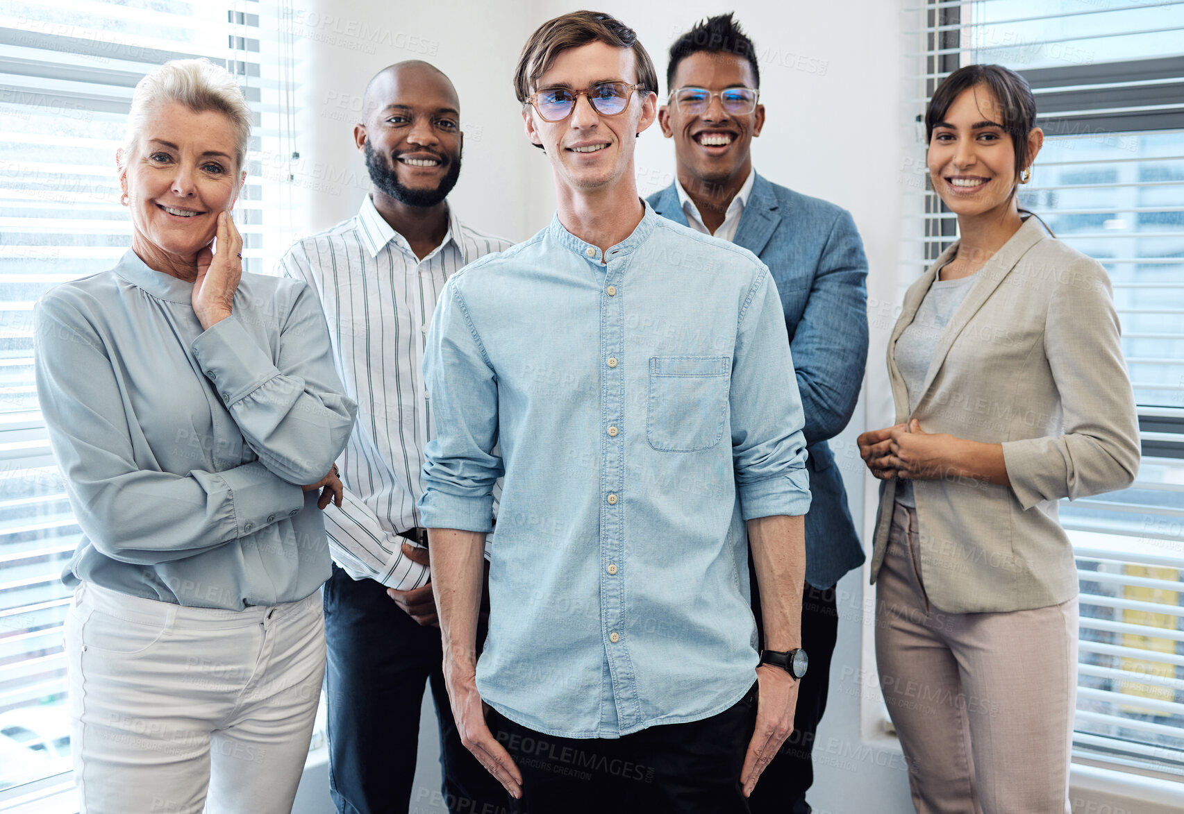 Buy stock photo Male leader, team diversity and smiling in office for recruitment, human resources and onboarding. Man, confident and hiring staff for teamwork in portrait, company and new career opportunity