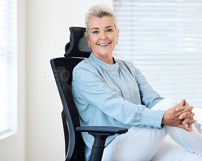 Buy stock photo Portrait of a confident mature businesswoman sitting on a chair in an office