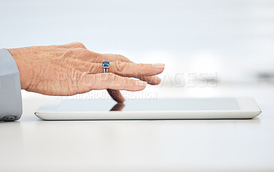 Buy stock photo Closeup shot of an unrecognisable businesswoman working on a digital tablet in an office