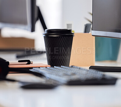 Buy stock photo Closeup shot of a coffee cup on a desk in an office