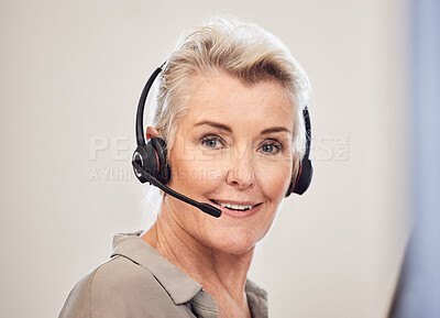 Buy stock photo Portrait of a senior businesswoman wearing a headset while working in an office