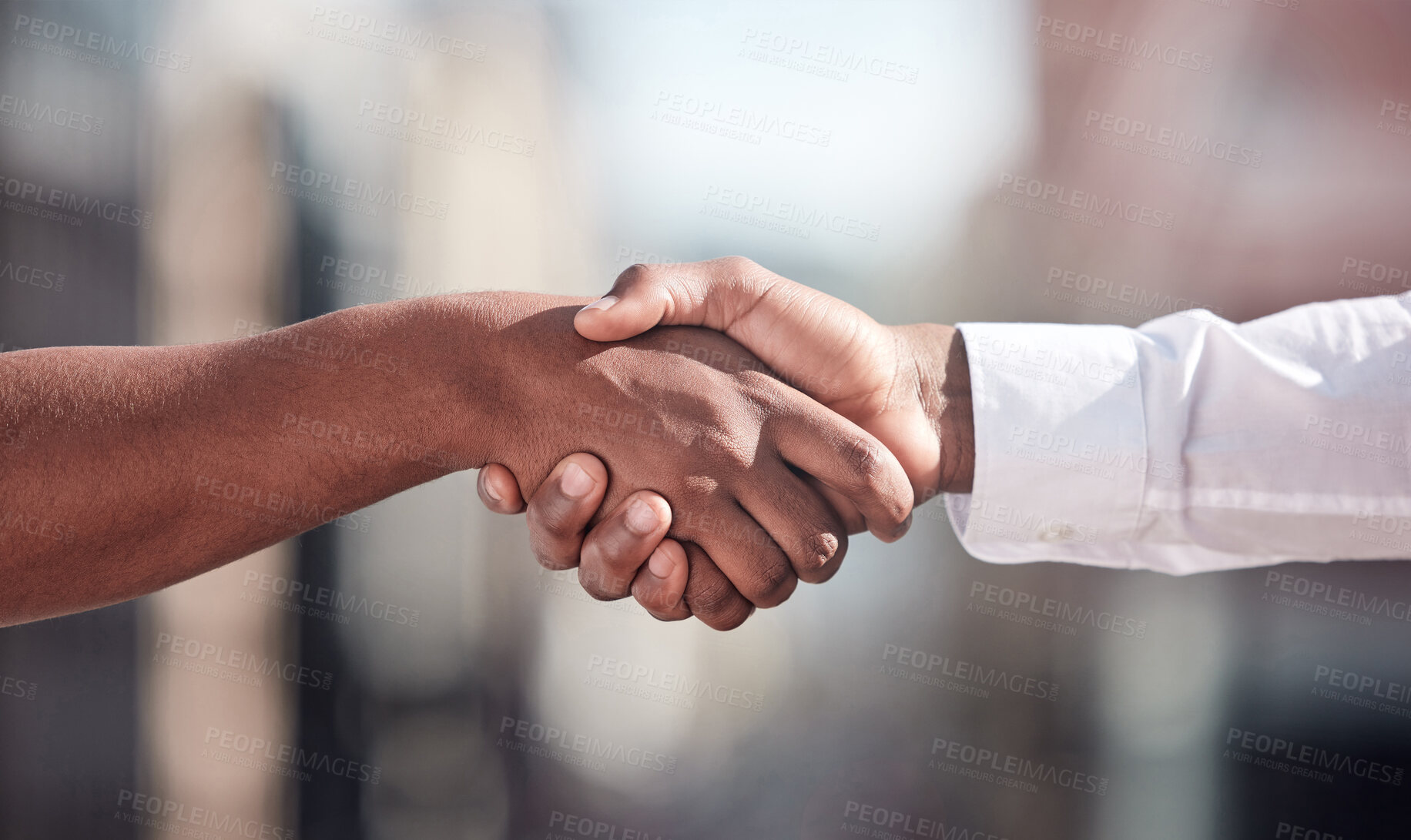 Buy stock photo Cropped shot of two unrecognizable businessmen shaking hands outside