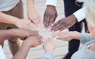 Buy stock photo Cropped shot of a group of unrecognizable businesspeople joining their hands together