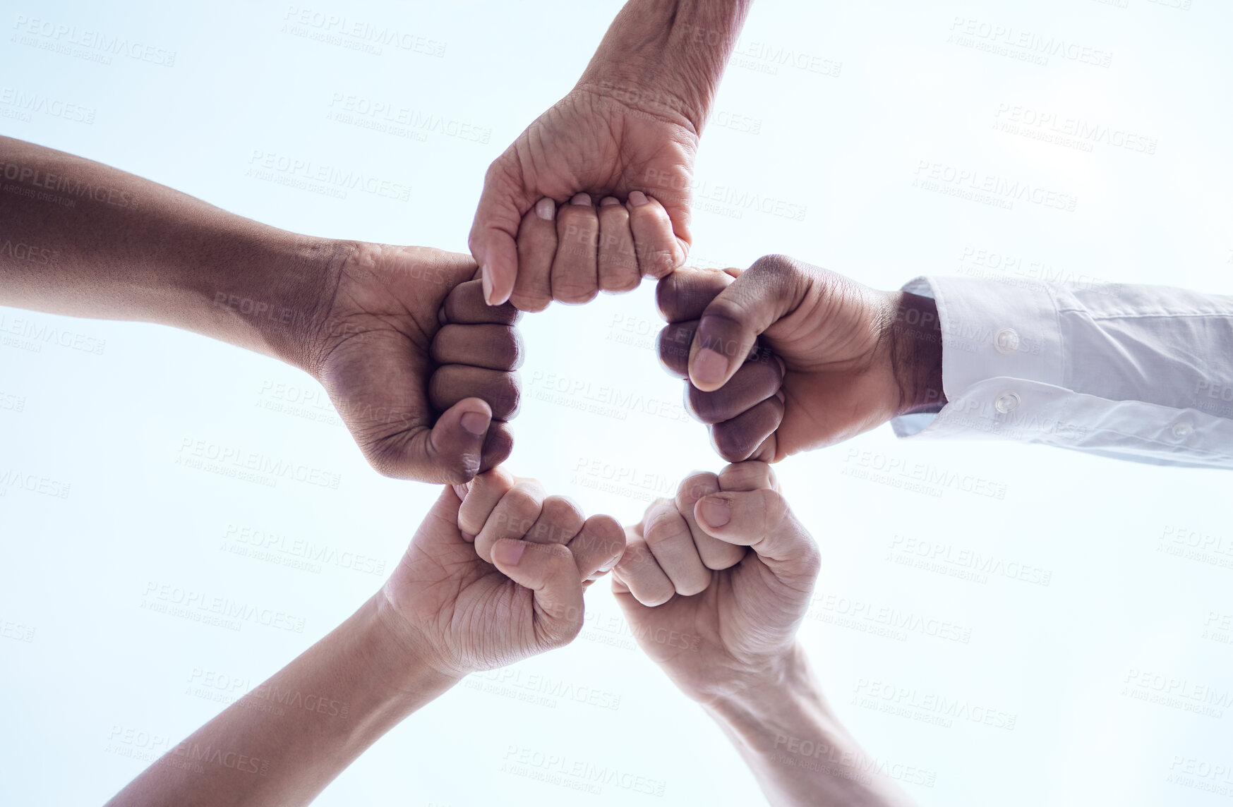 Buy stock photo Business, people and hands with fist bump in outdoor for partnership, teamwork and negotiation for success of deal merge. Group, man and circle for agreement, trust and networking for celebration