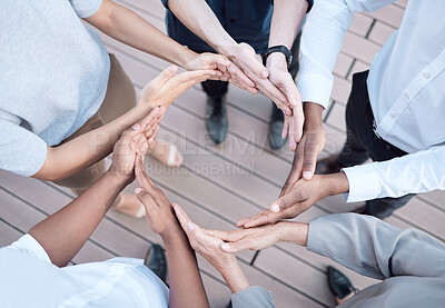 Buy stock photo Shot of a group of unrecognizable businesspeople forming a circle with their hands