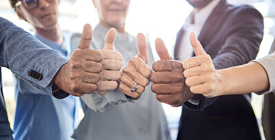 Buy stock photo Closeup shot of a group of unrecognisable businesspeople showing thumbs up together in an office