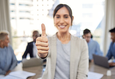 Buy stock photo Closeup shot of a young businesswoman showing thumbs up in an office with her colleagues in the background