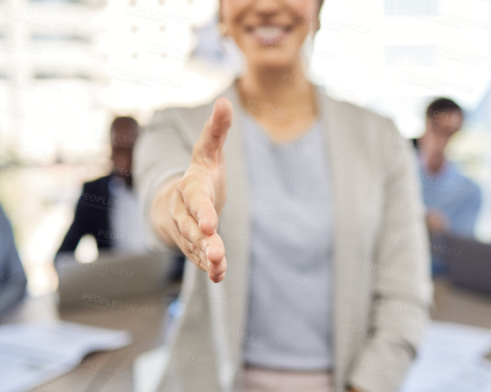 Buy stock photo Closeup shot of an unrecognisable businesswoman extending a handshake in an office